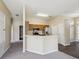 This spacious kitchen is equipped with stainless steel appliances and plenty of counter space for food preparation at 5048 Teather St, Spring Hill, FL 34608