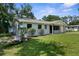 Charming home with a well-maintained lawn and inviting front entrance at 5215 Azalea Cir, Dade City, FL 33523