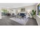 Bright living room with lots of seating and glass doors leading to the outside at 5215 Azalea Cir, Dade City, FL 33523