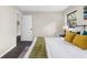 Warm main bedroom, featuring an inviting bed, lots of light, and stylish furniture at 5215 Azalea Cir, Dade City, FL 33523