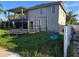 Backyard featuring a trampoline and outdoor workout equipment, providing ample space for recreation and fitness at 5420 Bay Blvd, Port Richey, FL 34668