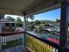 Balcony view overlooking a scenic canal with docks and lush landscaping, offering a serene waterfront living experience at 5420 Bay Blvd, Port Richey, FL 34668