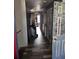 Hallway leading to laundry area and back of the home; this view highlights the home's layout and functionality at 5420 Bay Blvd, Port Richey, FL 34668
