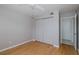 Cozy bedroom featuring a ceiling fan, hardwood floors, and a spacious closet at 5640 Ferguson Ct # 2203, New Port Richey, FL 34652