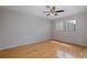 Bright bedroom featuring natural light, ceiling fan, and hardwood flooring at 5640 Ferguson Ct # 2203, New Port Richey, FL 34652