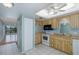 Efficient kitchen with modern appliances, ample counter space, and natural light at 5640 Ferguson Ct # 2203, New Port Richey, FL 34652