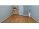 Spacious living room featuring hardwood floors with view into the kitchen at 5640 Ferguson Ct # 2203, New Port Richey, FL 34652