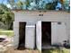 Open garage door revealing ample storage space, offering convenience and organization for tools and equipment at 5748 Montana Ave, New Port Richey, FL 34652