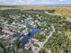 Beautiful aerial view of a waterfront community featuring houses with private docks and access to canals and waterways at 6241 Colony Cir, Weeki Wachee, FL 34607