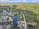 Stunning aerial view of waterfront home with private dock and access to the open water and beautiful natural surroundings at 6241 Colony Cir, Weeki Wachee, FL 34607