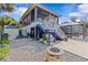 This house boasts an extensive backyard with both a screened porch and an exterior firepit area at 6241 Colony Cir, Weeki Wachee, FL 34607
