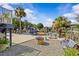 The spacious backyard features canal views, a stone firepit, landscaping, and bench seating at 6241 Colony Cir, Weeki Wachee, FL 34607