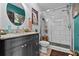 Stylish bathroom features a granite countertop, a new glass shower enclosure, and artistic decor at 6241 Colony Cir, Weeki Wachee, FL 34607