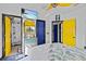 Bedroom with colorful doors, TV, and vibrant, tropical decor at 6241 Colony Cir, Weeki Wachee, FL 34607
