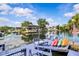 Private dock with colorful kayaks, outdoor seating, and direct access to the water, enhancing waterfront living at 6241 Colony Cir, Weeki Wachee, FL 34607
