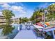 Dock featuring kayak storage, outdoor seating, and direct water access, enhancing waterfront living experience at 6241 Colony Cir, Weeki Wachee, FL 34607