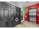Entrance with black doors, nautical-themed decor, and an elevator at 6241 Colony Cir, Weeki Wachee, FL 34607