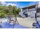 This home offers ample backyard space, canal views, and includes a seating area with a porch swing at 6241 Colony Cir, Weeki Wachee, FL 34607