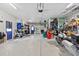 Well-organized garage featuring storage, a motorcycle, and secondary access doors at 6241 Colony Cir, Weeki Wachee, FL 34607