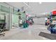 Spacious garage with ample storage, fan, and motorcycle parking at 6241 Colony Cir, Weeki Wachee, FL 34607