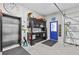 Multi-purpose garage space featuring storage, a service elevator, and work area at 6241 Colony Cir, Weeki Wachee, FL 34607