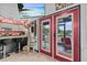 Bright living area with modern kitchen, cat tree, and access to screened-in porch at 6241 Colony Cir, Weeki Wachee, FL 34607
