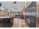 View of an eclectic living room and kitchen with colorful decor and island countertop at 6241 Colony Cir, Weeki Wachee, FL 34607