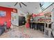 Open living area features modern flooring, breakfast bar with seating, and combined living and kitchen design at 6241 Colony Cir, Weeki Wachee, FL 34607