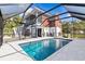 A screened in pool area provides backyard privacy, complemented by views of the house's screened porch at 6241 Colony Cir, Weeki Wachee, FL 34607
