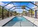 Inviting enclosed pool area, perfect for relaxing and enjoying the outdoors in a private setting at 6241 Colony Cir, Weeki Wachee, FL 34607