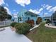 Unique backyard with charming coastal decor, lush greenery, and a whimsical fishing theme, creating a delightful outdoor space at 6737 Clark St, Hudson, FL 34667