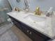 Bathroom vanity with dual sinks, quartz countertop, and modern gold faucets at 6737 Clark St, Hudson, FL 34667