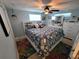Stylish bedroom featuring ocean themed decorations and a ceiling fan at 6737 Clark St, Hudson, FL 34667