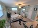 Bright bedroom with stylish decor, including a starfish rug and calming colors at 6737 Clark St, Hudson, FL 34667