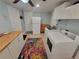 Laundry room featuring modern appliances and a bright, spacious layout at 6737 Clark St, Hudson, FL 34667