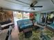 Relaxing living room area with plush seating and a view of the screened-in pool at 6737 Clark St, Hudson, FL 34667