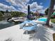 Waterfront property featuring an outdoor dining set, perfect for enjoying waterfront views and outdoor meals at 6737 Clark St, Hudson, FL 34667