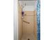 Bathroom with tiled shower and handrail at 6930 El Camino Paloma St, Port Richey, FL 34668