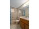 Bathroom showcases a shower-tub combination, and neutral fixtures at 6930 El Camino Paloma St, Port Richey, FL 34668