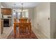 Dining area next to the kitchen with a wooden dining set at 6930 El Camino Paloma St, Port Richey, FL 34668