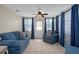 Inviting Florida room with tile floors, lots of windows, and comfortable furnishings at 6930 El Camino Paloma St, Port Richey, FL 34668