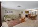 Open-concept living and dining area with neutral tones and tile flooring at 6930 El Camino Paloma St, Port Richey, FL 34668