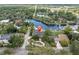Stunning aerial view of a waterfront home featuring lush landscaping and a private dock at 6936 River Rd, New Port Richey, FL 34652
