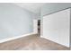 Neutral bedroom with carpet floors, closet and access to other areas at 6936 River Rd, New Port Richey, FL 34652