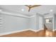Spacious bedroom featuring decorative crown molding, recessed lighting, and new hardwood floors at 6936 River Rd, New Port Richey, FL 34652