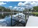 Modern boat lift on the waterfront for convenient and secure boat storage with easy access to the water at 6936 River Rd, New Port Richey, FL 34652