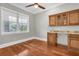 Bonus room featuring a wet bar, hardwood floors and natural light at 6936 River Rd, New Port Richey, FL 34652