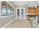 Cozy breakfast nook with natural light, views of the outdoor space, and access to the kitchen at 6936 River Rd, New Port Richey, FL 34652