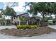 Attractive two-story home with a landscaped front yard and a two-car garage at 6936 River Rd, New Port Richey, FL 34652