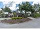Beautiful two-story home with a landscaped front yard and a two-car garage at 6936 River Rd, New Port Richey, FL 34652